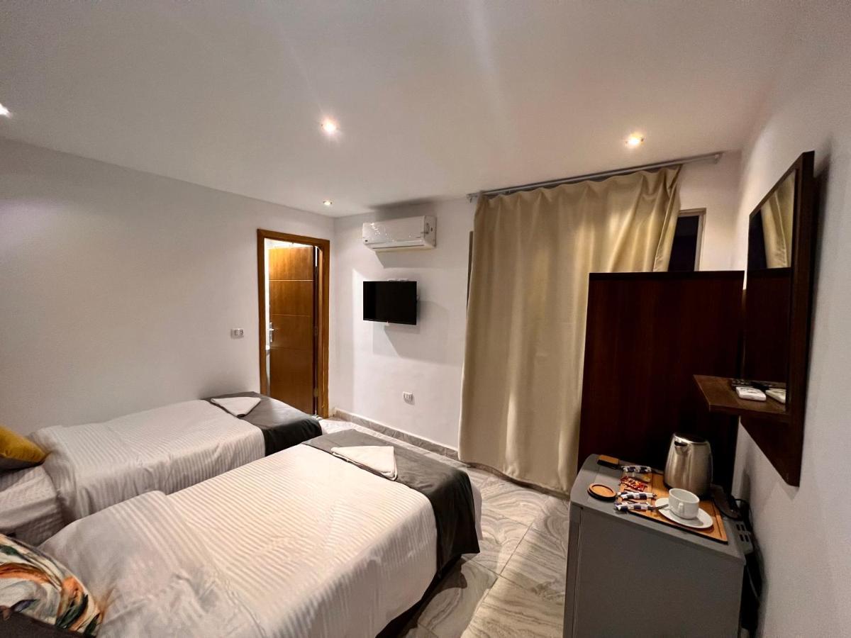 Grand Pyramids Inn Kafret el-Gabal Exteriör bild